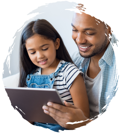 Father reading to their pre-school daughter