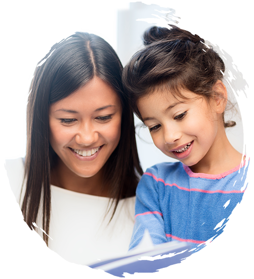 Teacher helping preschooler to read